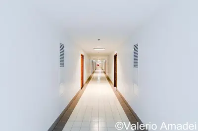 an empty corridor in an office building at OMNIAPHUKET - Patong Tower - Premium 3 Bedrooms Apartment in Patong Beach