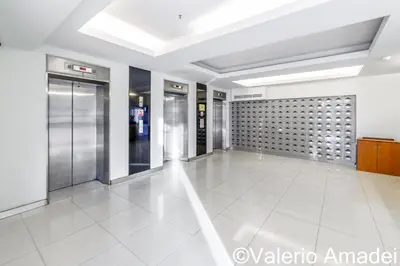 an empty lobby with elevators in a building at OMNIAPHUKET - Patong Tower - Premium 3 Bedrooms Apartment in Patong Beach