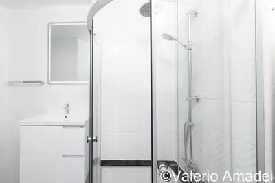 a bathroom with a shower and a sink at OMNIAPHUKET - Patong Center Pool Gym Near Bangla Road in Patong Beach