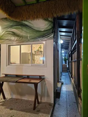 a room with a window on the side of a building at Little Green House in Ao Nang Beach
