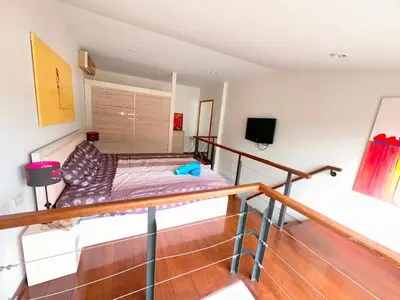 a room with a bunk bed on a balcony at Patong Penthouse 1 bedroom in Patong Beach