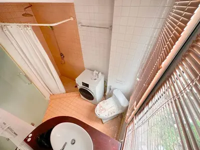 a small bathroom with a toilet and a sink at Patong Penthouse 1 bedroom in Patong Beach