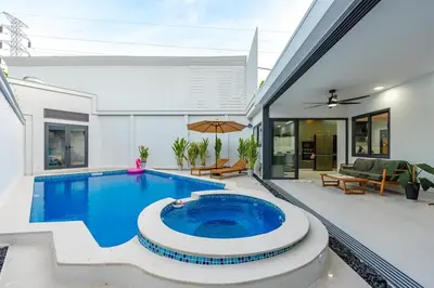 a swimming pool in the backyard of a house at V215 ChaoFah Oasis Private Pool & Garden Retreat in Phuket Town