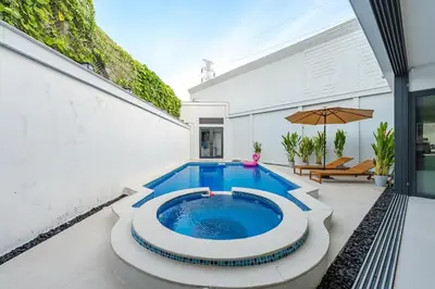 a swimming pool in the middle of a patio at V215 ChaoFah Oasis Private Pool & Garden Retreat in Phuket Town