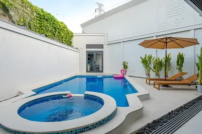 a swimming pool in the middle of a patio at V215 ChaoFah Oasis Private Pool & Garden Retreat in Phuket Town