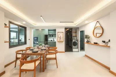 a kitchen and dining room with a table and chairs at V215 ChaoFah Oasis Private Pool & Garden Retreat in Phuket Town