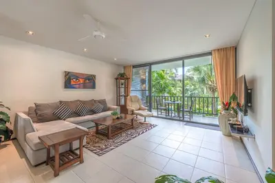 a living room with a couch and a table at C215 Pool View 2BR and 200m to Beach Prime Location in Surin Beach