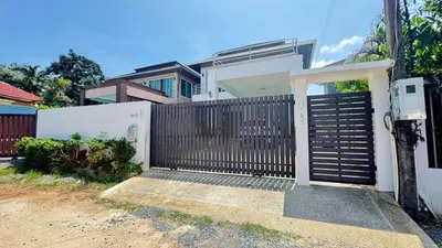 a gate in front of a house at Ban Khuendee Pool Villa in Kathu