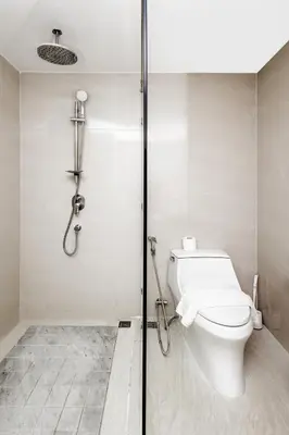a bathroom with a toilet and a shower at Suite Elio 1BR PoolsGym Shuttle to Nai Harn in Rawai Beach