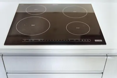 a close up of a stove top oven at Suite Velora 3BR Pool GymCassia Laguna Phuket in Laguna Phuket