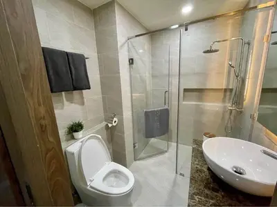 a bathroom with a toilet and a sink and a shower at Sea Breeze 2 Bedrooms Rawai Naiharn Beach in Rawai Beach