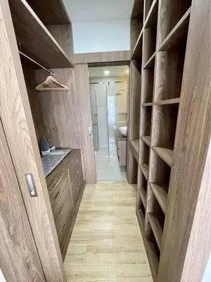 a large bathroom with wooden shelves and a sink at Sea Breeze 2 Bedrooms Rawai Naiharn Beach in Rawai Beach