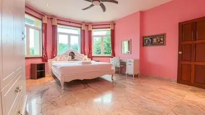 a bedroom with pink walls and a bed at Sundrenched Oasis 7bed pool villa heart of Phuket in Kathu