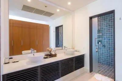 a bathroom with two sinks and a shower at Villa Marina Cape Yamu Luxury 6 Bedroom Seaview Villa, Free Breakfast, Airport Pickup and Drop-off, Servant in Ko Lek