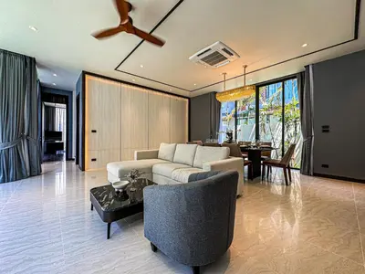 a living room with a couch and a table at The Ozone Luxury Villas Phuket in Laguna Phuket