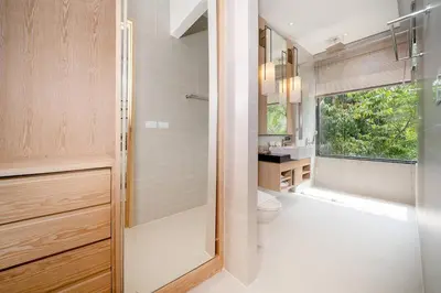 a bathroom with a shower and a toilet and a sink at The Exclusive Sky D4 \u8c6a\u534e4\u5367\u5ba4\u6d77\u666f\u522b\u5885 \u79c1\u4eba12m\u65e0\u8fb9\u6d77\u666f\u6cf3\u6c60 \u6bcf\u65e5\u6e05\u6d01 in Kamala Beach