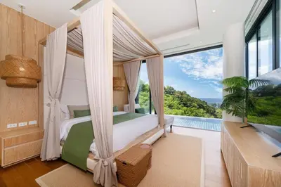 a bedroom with a canopy bed and a pool at The Exclusive Sky D4 \u8c6a\u534e4\u5367\u5ba4\u6d77\u666f\u522b\u5885 \u79c1\u4eba12m\u65e0\u8fb9\u6d77\u666f\u6cf3\u6c60 \u6bcf\u65e5\u6e05\u6d01 in Kamala Beach
