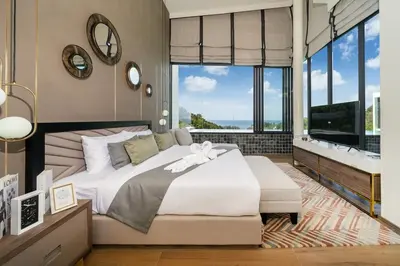a bedroom with a large bed and large windows at The Exclusive Sky D2 \u8c6a\u534e4\u5367\u5ba4\u6d77\u666f\u522b\u5885 \u79c1\u4eba12m\u65e0\u8fb9\u6d77\u666f\u6cf3\u6c60 \u6bcf\u65e5\u6e05\u6d01 in Kamala Beach