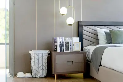 a bedroom with a bed and a table with a night stand at The Exclusive Sky D2 \u8c6a\u534e4\u5367\u5ba4\u6d77\u666f\u522b\u5885 \u79c1\u4eba12m\u65e0\u8fb9\u6d77\u666f\u6cf3\u6c60 \u6bcf\u65e5\u6e05\u6d01 in Kamala Beach