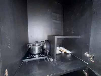a small kitchen with a pot on a stove at Patong Easy Life 1 in Patong Beach