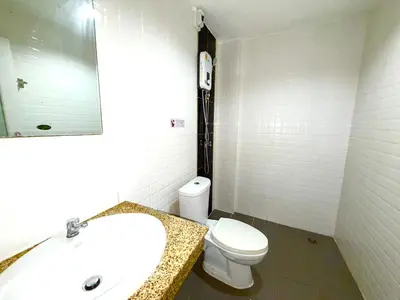 a bathroom with a sink and a toilet and a mirror at Patong Easy Life 1 in Patong Beach