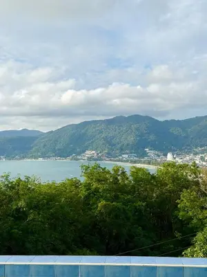 a view of a large body of water with mountains at Villa Seaview Patong in Patong Beach