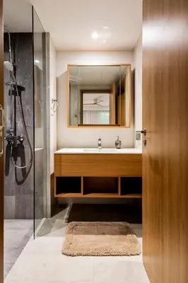 a bathroom with a sink and a mirror at Private garden Laguna beachside 150 m Bangtao in Bang Tao Beach