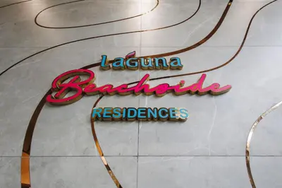 a neon sign for a restaurant on a tile floor at Private garden Laguna beachside 150 m Bangtao in Bang Tao Beach