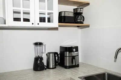 a kitchen counter with a coffee maker and a blender at ME5 Halo 2-bedroom ВатСaп66935B2I976 вид на бассейн in Nai Yang Beach