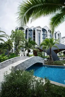 a swimming pool in front of a building at ME5 Halo 2-bedroom ВатСaп66935B2I976 вид на бассейн in Nai Yang Beach