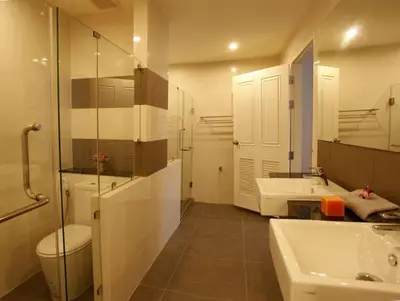 a bathroom with a sink and a toilet and a mirror at Sea view apartment in Phuket in Patong Beach