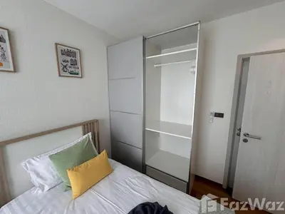 a bedroom with a bed and a glass closet at VE1 Halo 2-bedroom ВатСaп66935B2I976 in Nai Yang Beach