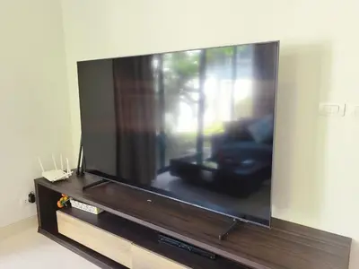 a large flat screen tv sitting in a living room at \u65e0\u5c18\u522b\u9662 Pure Haven Villa in Ban Phru Champa