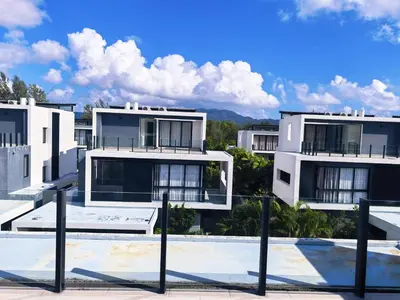 a group of white buildings with a blue sky at \u65e0\u5c18\u522b\u9662 Pure Haven Villa in Ban Phru Champa