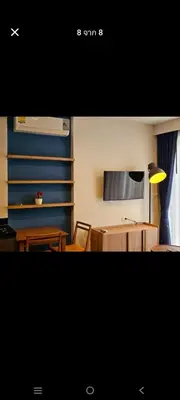 a room with a table and chairs and a lamp at The deck patong 2bedroom in Patong Beach