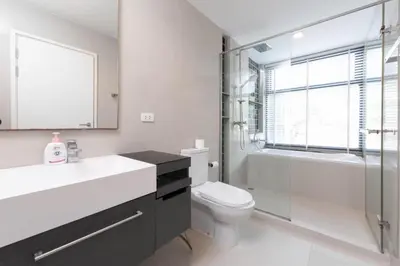 a bathroom with a toilet and a sink and a shower at The deck patong 2bedroom in Patong Beach