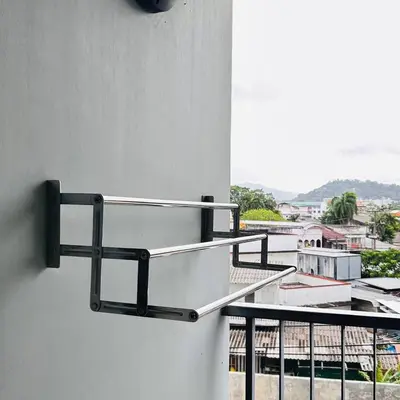 a metal towel rack on a wall with a balcony at Vista Phuket Old Town Gym Pool Wifi Netflix Walk to All in Phuket Town