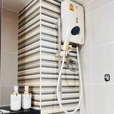 a shower in the corner of a bathroom at Vista Phuket Old Town Gym Pool Wifi Netflix Walk to All in Phuket Town