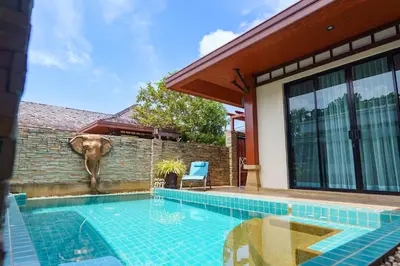 a swimming pool in front of a house at Villa with Private Pool in Rawai in Rawai Beach