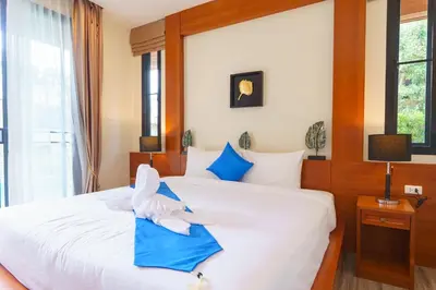a bedroom with a bed with a stuffed animal on it at Villa with Private Pool in Rawai in Rawai Beach