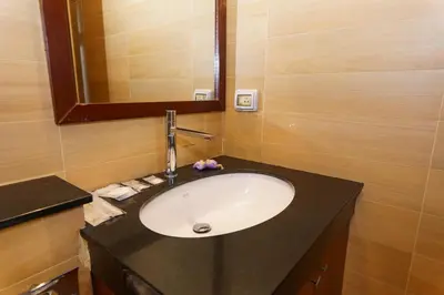 a bathroom with a sink and a mirror at Villa with Private Pool in Rawai in Rawai Beach