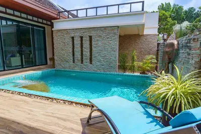 a swimming pool in front of a house at Villa with Private Pool in Rawai in Rawai Beach