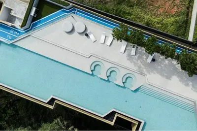 an overhead view of a building with a swimming pool at NEW! Laguna Beachside Apt 100 m2 in Ban Thalat Choeng Thale