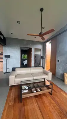 a living room with a white couch and a ceiling fan at New 2 BR Villa Nai Thon in Nai Yang Beach