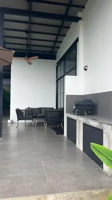 a patio with chairs and a couch in a building at New 2 BR Villa Nai Thon in Nai Yang Beach