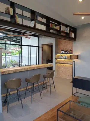 a kitchen with chairs and a counter in a room at New 2 BR Villa Nai Thon in Nai Yang Beach