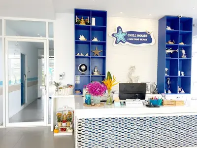a store with a counter with a blue wall at Chill House at Naiyang in Nai Yang Beach