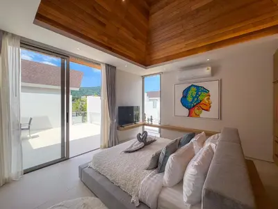 a bedroom with a large bed and a large window at Luxurious 3-Bedroom Villa with Private Pool Lux Pride 4 L10 Phuket in Bang Tao Beach