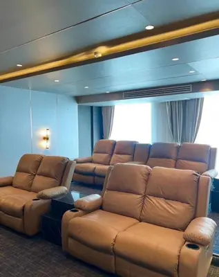 a living room with a large leather couch and a large couch at Luxury Condo The City Phuket in Heart of Phuket in Kathu