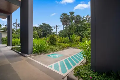 a swimming pool in the middle of a yard at Laguna Beachside Block 3 by Banyan Living in Ban Thalat Choeng Thale